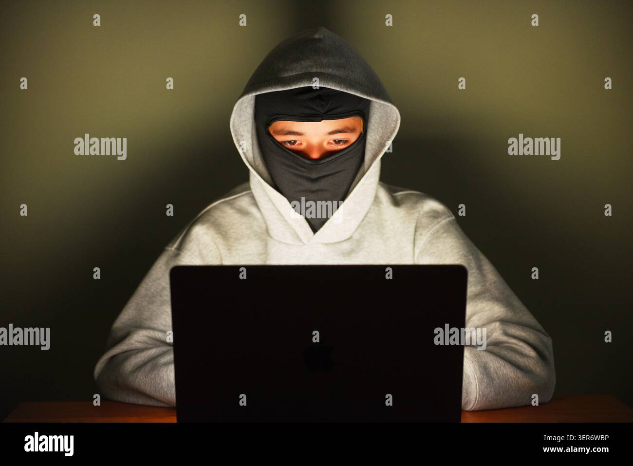 Cyber attacker Stock Photo