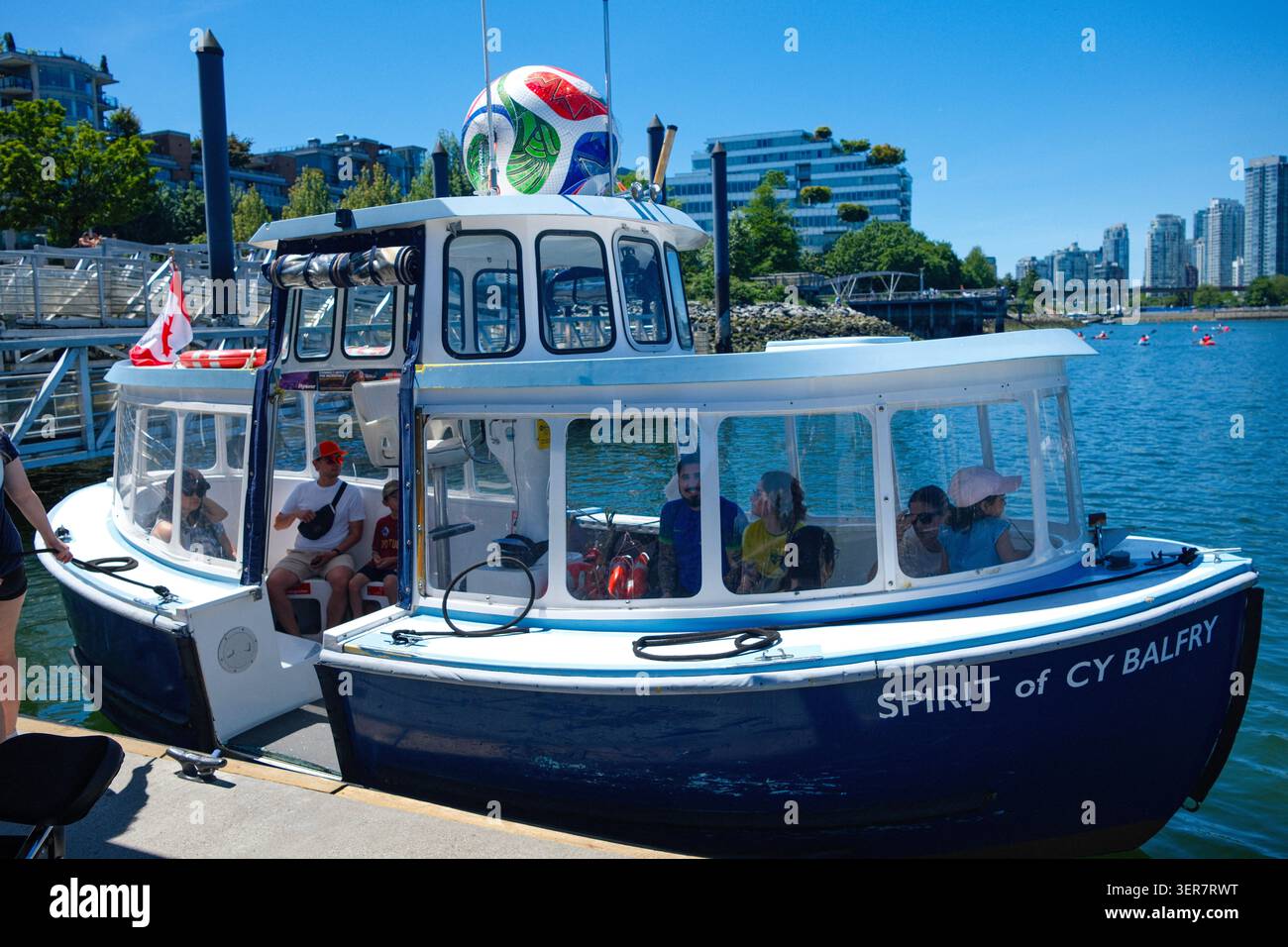A False Creek Ferry With A FIFA Soccer Ball Atop At The Olympic Village a-false-creek-ferry-with-a-fifa-soccer-ball-atop-at-the-olympic-village
