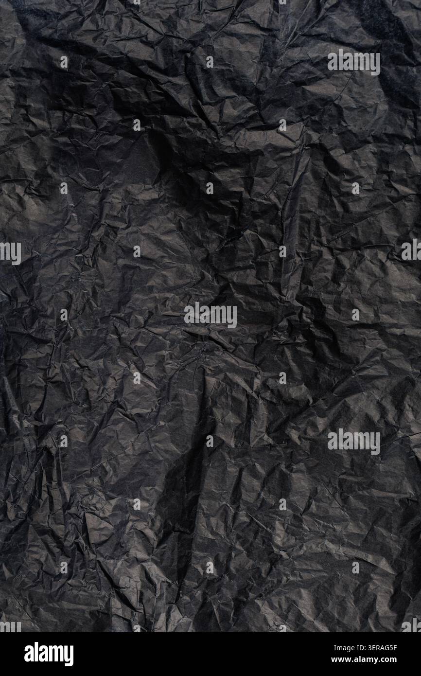 Vertical Black Crumpled Paper Texture Background Stock Photo