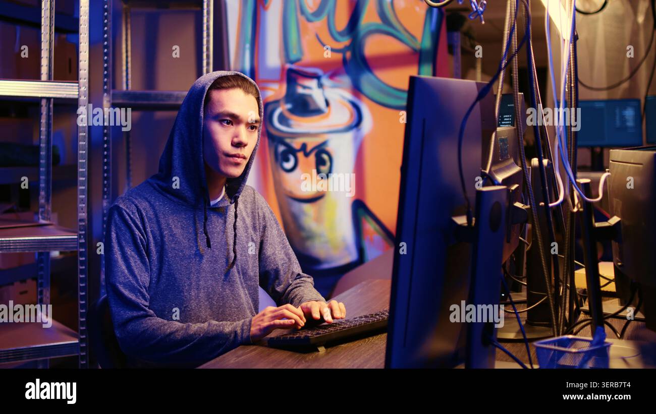 Hacker group coordinating DDoS attack on website, working on multiple computers to sending large amounts of traffic and overwhelm it, rogue programmers in secret bunker flooding target server. Stock Photo