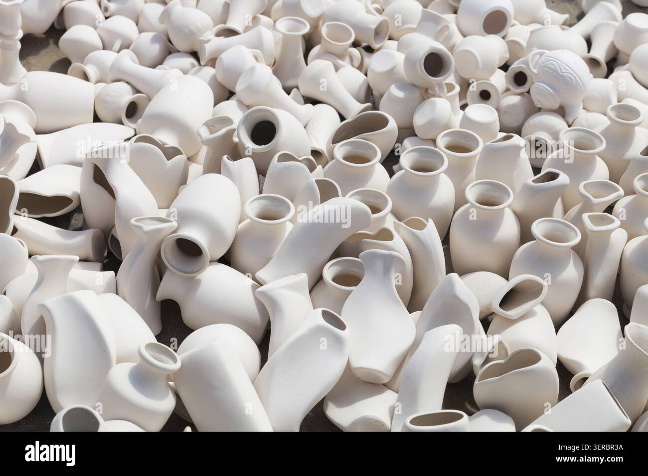 Many earthen pots kept for drying in the sun Stock Photo