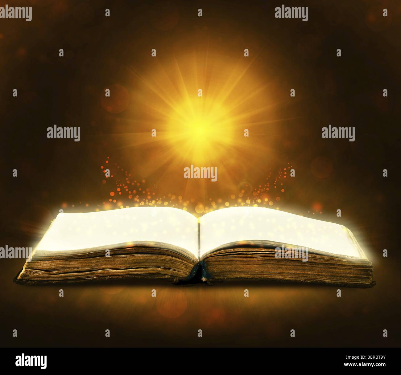 Old book with magic Ray of light Stock Photo