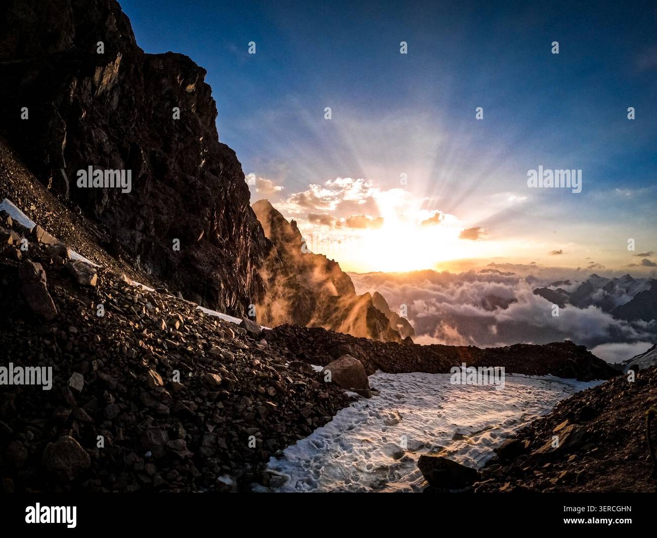 Sunset Rays over Mountain Glacier Stock Photo