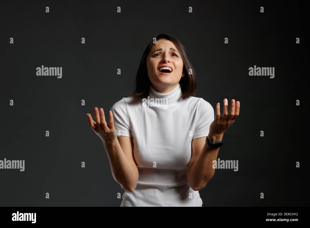Desperate woman screaming in despair Stock Photo