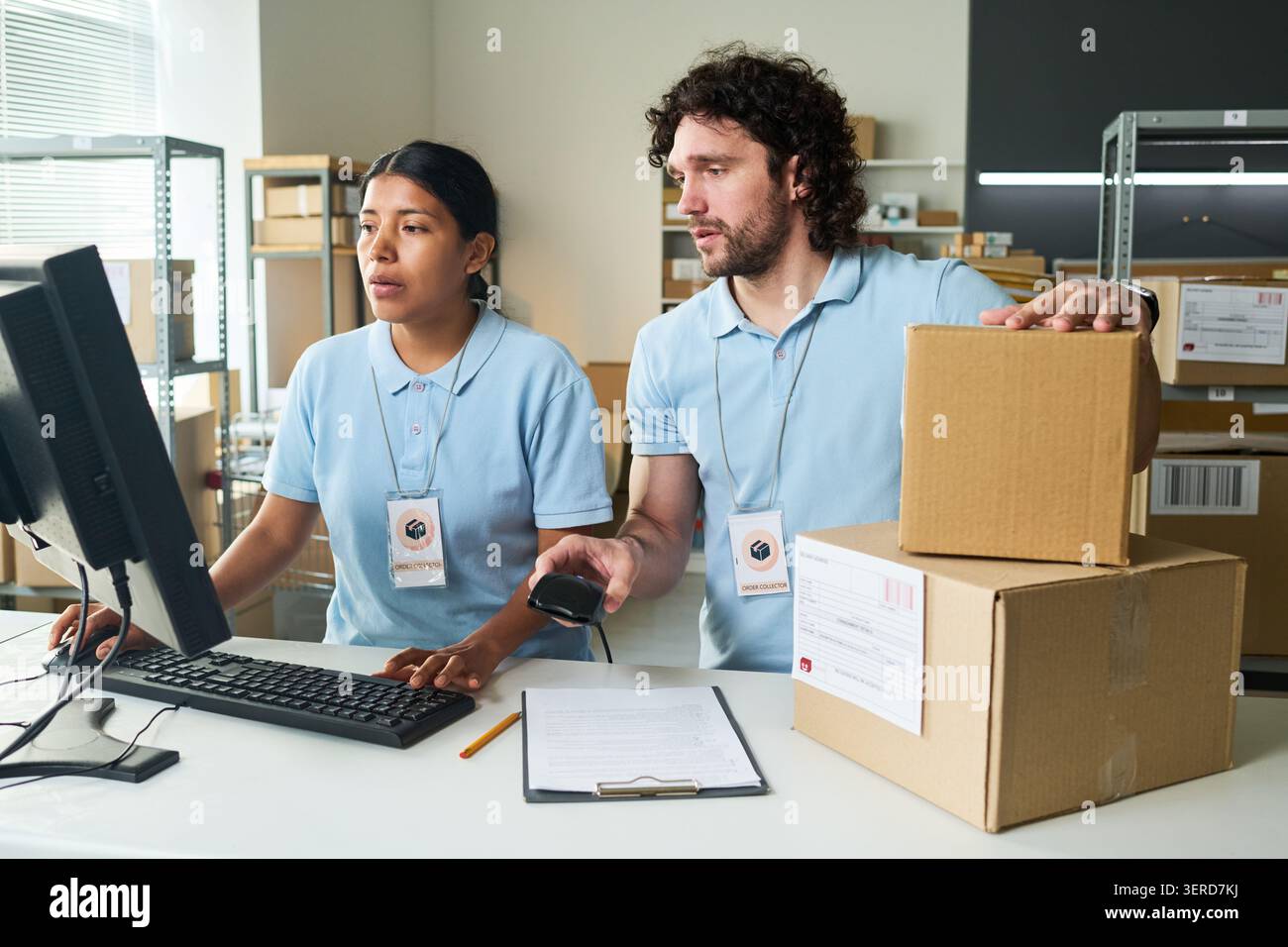 Warehouse Workers Processing Orders at Pickup Point Stock Photo