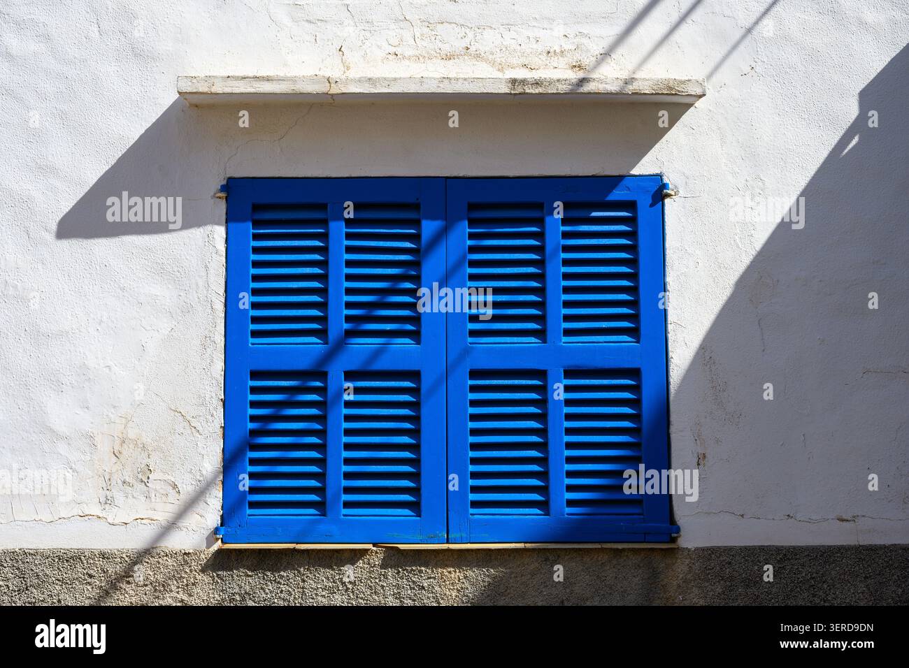 Vibrant blue window shutters, closed Stock Photo