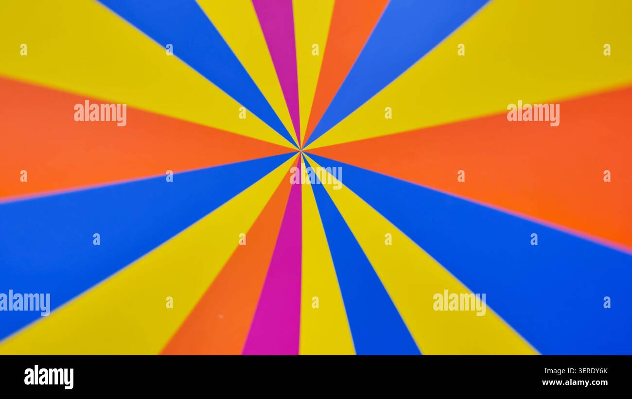 Bright rotating multicolored stripes on the wheel. Vibrant Radial Pattern with Bright Color. Stock Photo