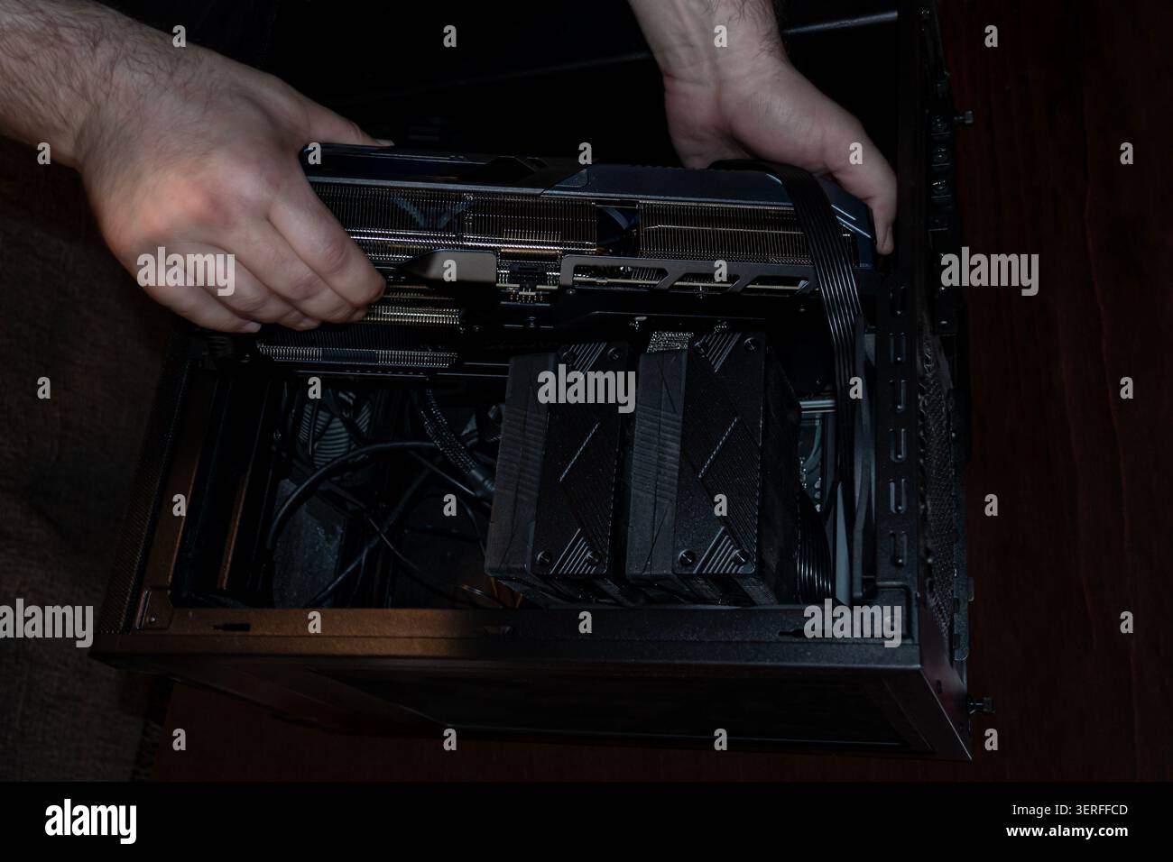 Installing Graphics Card in Open Desktop Computer Case Stock Photo