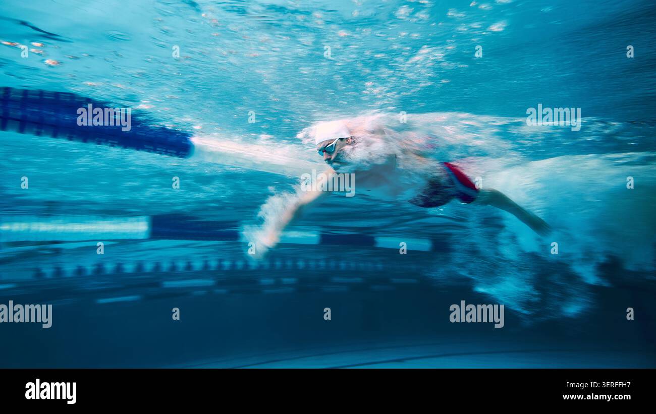 Swimmer moving fast through water with motion blur Stock Photo