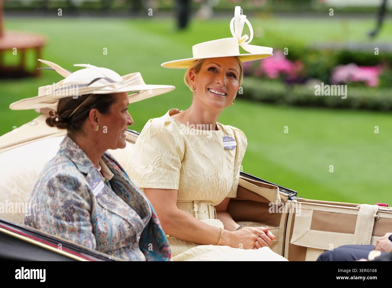 Zara Tindall smiles as she rides in a carriage as he attends the third ...