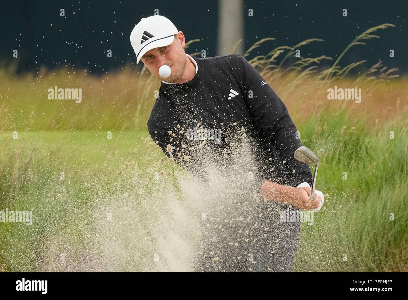 Ludvig Åberg, of Sweden, hits from the bunker on the second hole during ...