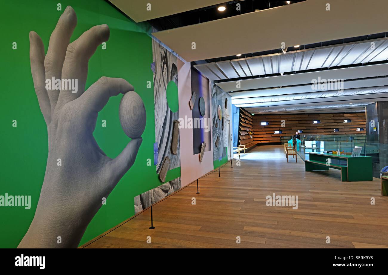 Interior of the Scottish Design Galleries at V&A Dundee, showing bold graphics, display cases and modern museum architecture. Stock Photo