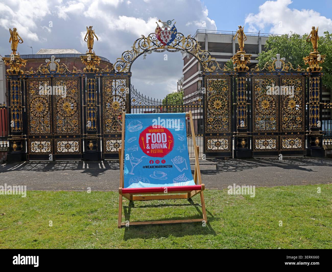 Giant WeAreWarrington BID deckchair at Warrington Food and Drink Festival outside the Town Hall golden gates, Cheshire, May 2026, WA1 1UH Stock Photo