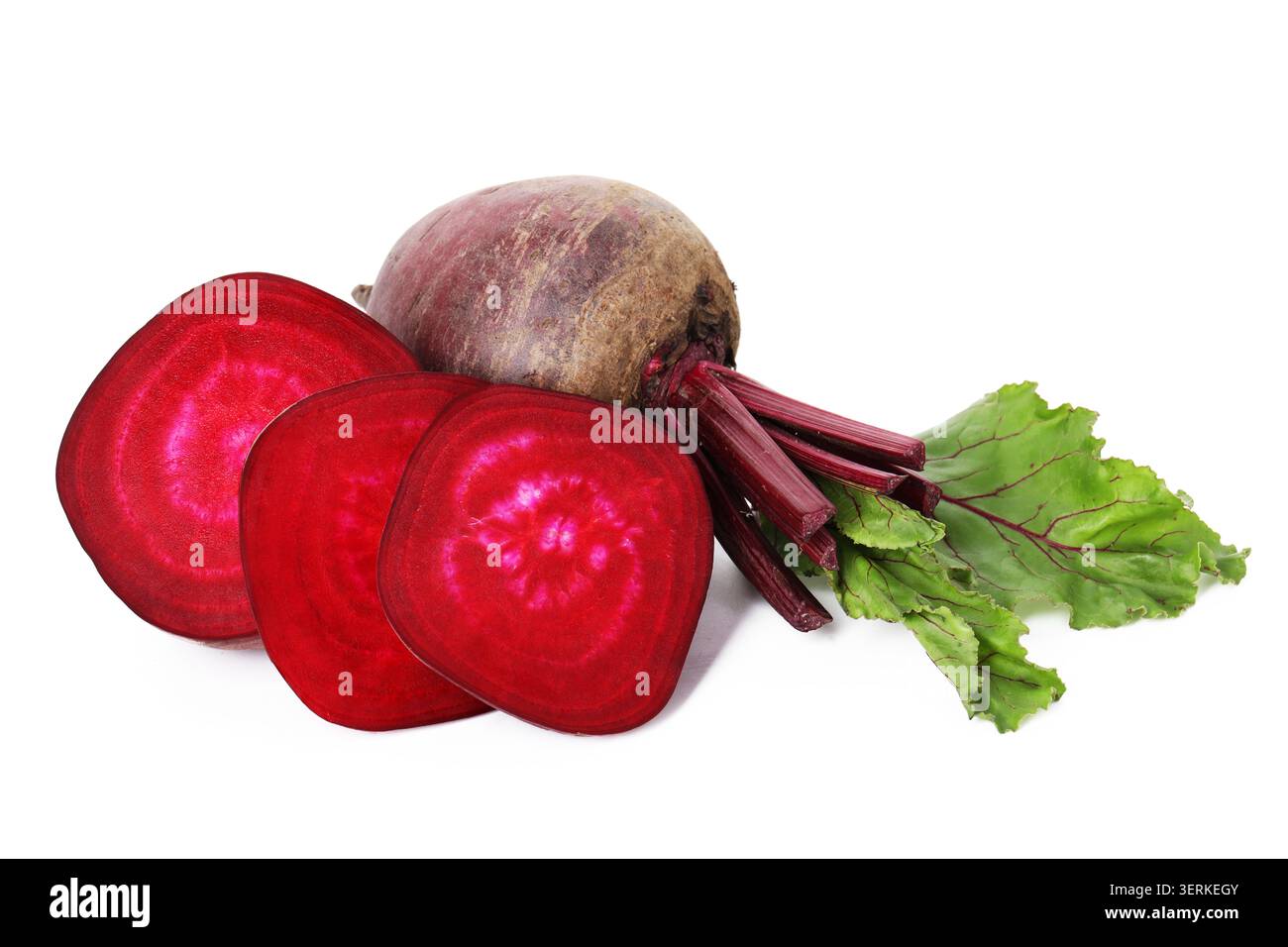 Whole and cut young beets with green leaves isolated on white Stock Photo