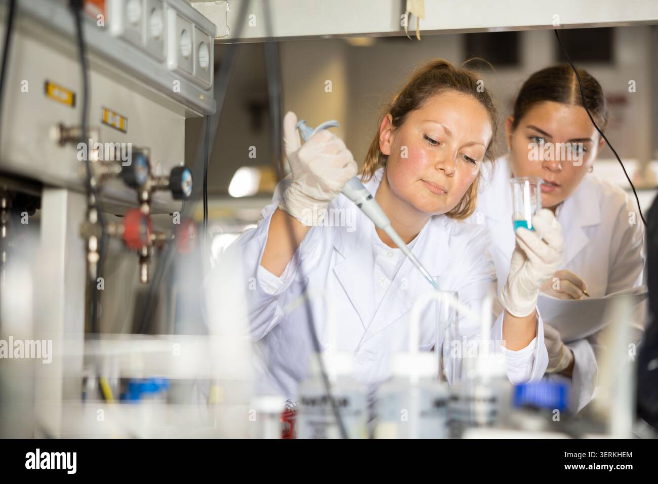 Confident women technicians working in research laboratory Stock Photo