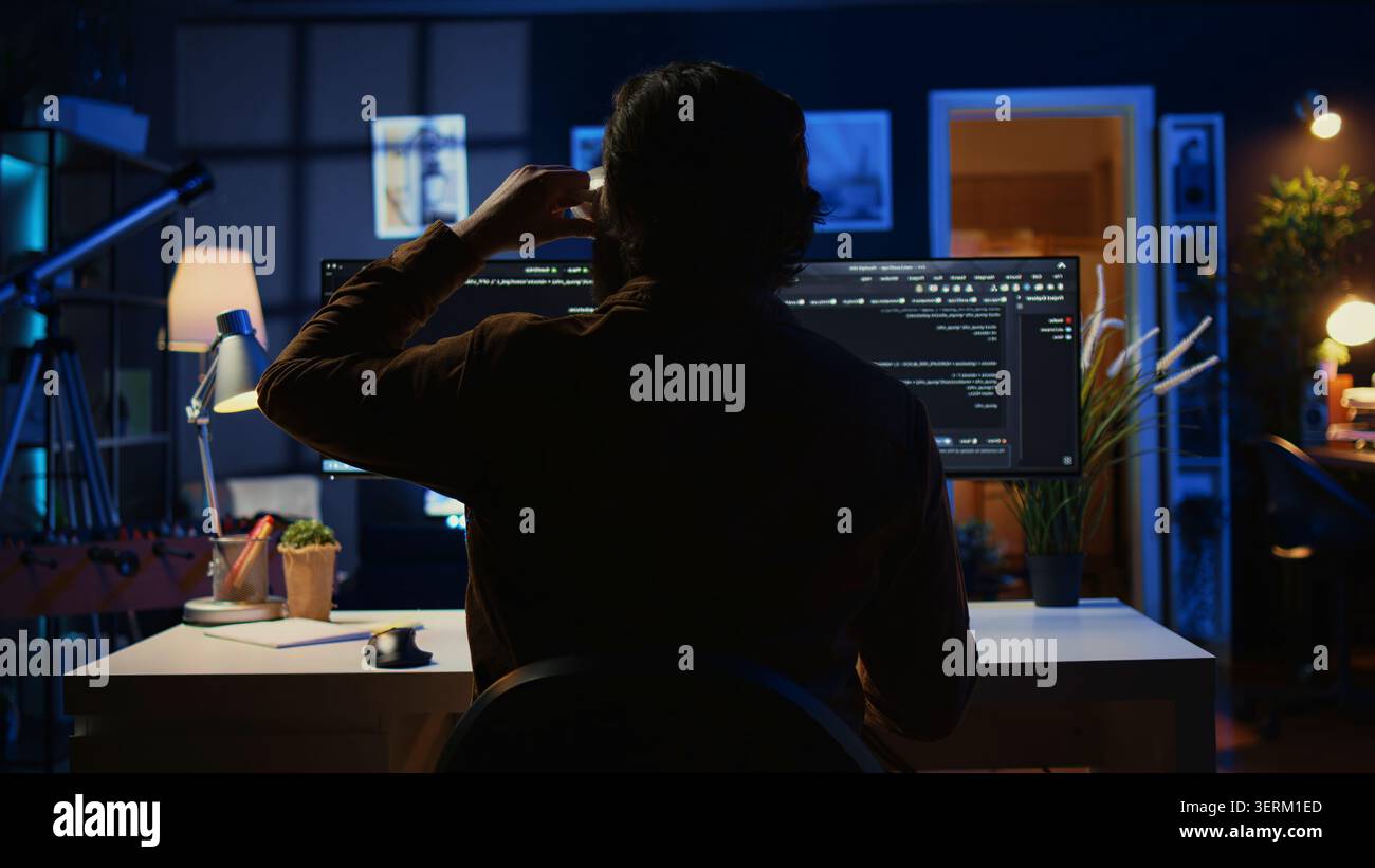 Software engineer writes complex binary code scripts on computer, close-up, teleworking IT specialist in home office using programming to safeguard consumer data, handheld hot. Stock Photo