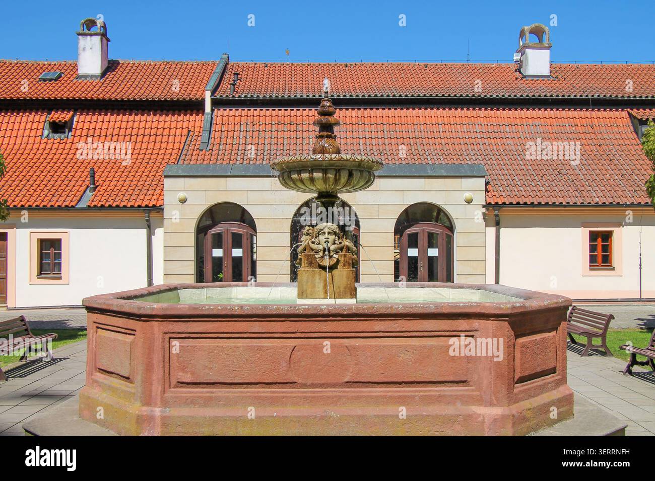 A view of a beautiful fountain on a summer day in the castle courtyard in the spa town of Podebrady, Czech Republic. Stock Photo
