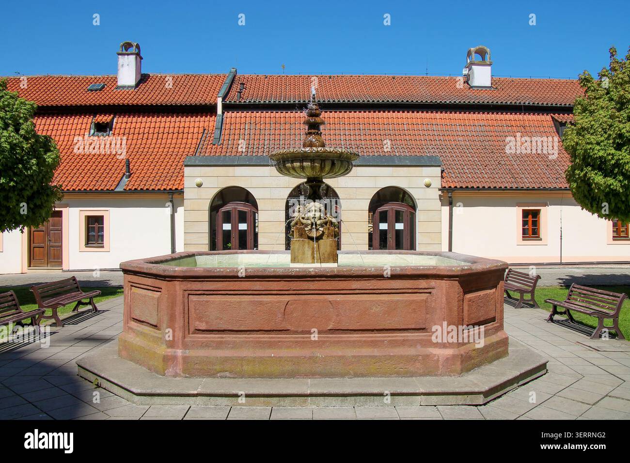 A view of a beautiful fountain on a summer day in the castle courtyard in the spa town of Podebrady, Czech Republic. Stock Photo