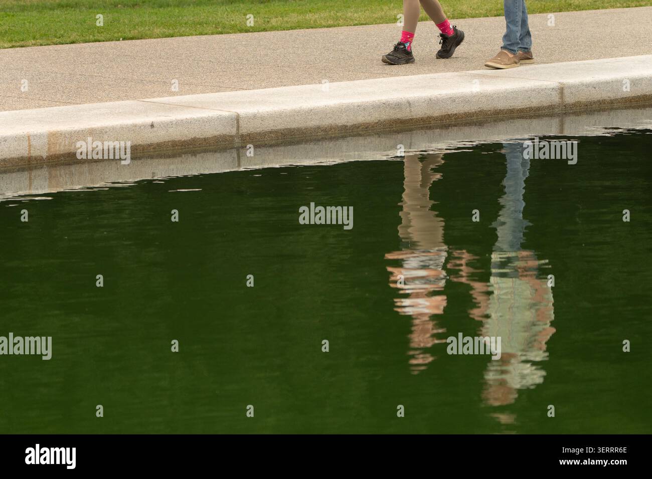 visitors-walk-along-the-edge-of-the-lincoln-memorial-reflecting-pool