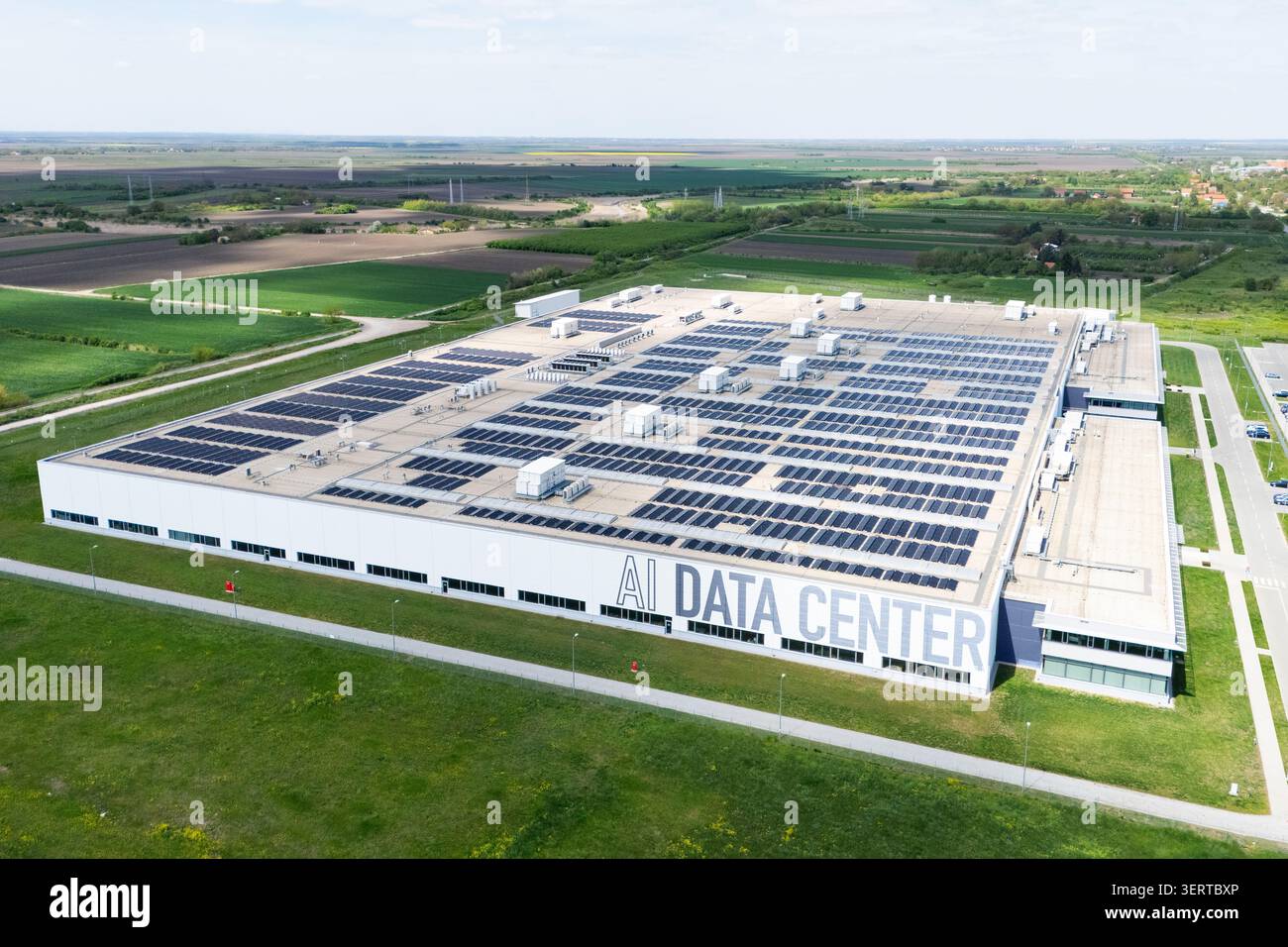 AI data processing center with rooftop solar panels Stock Photo