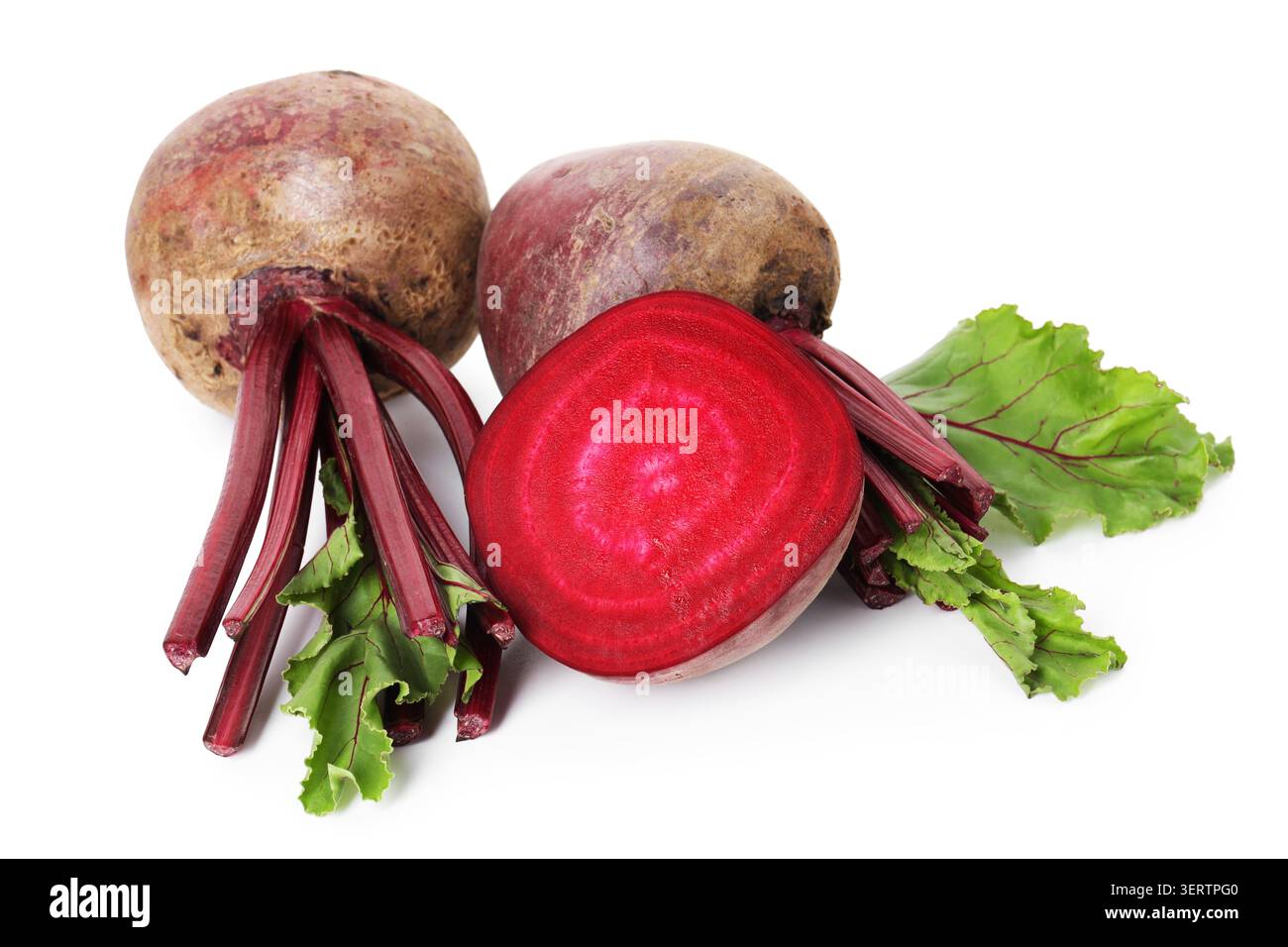 Whole and cut young beets with green leaves isolated on white Stock Photo
