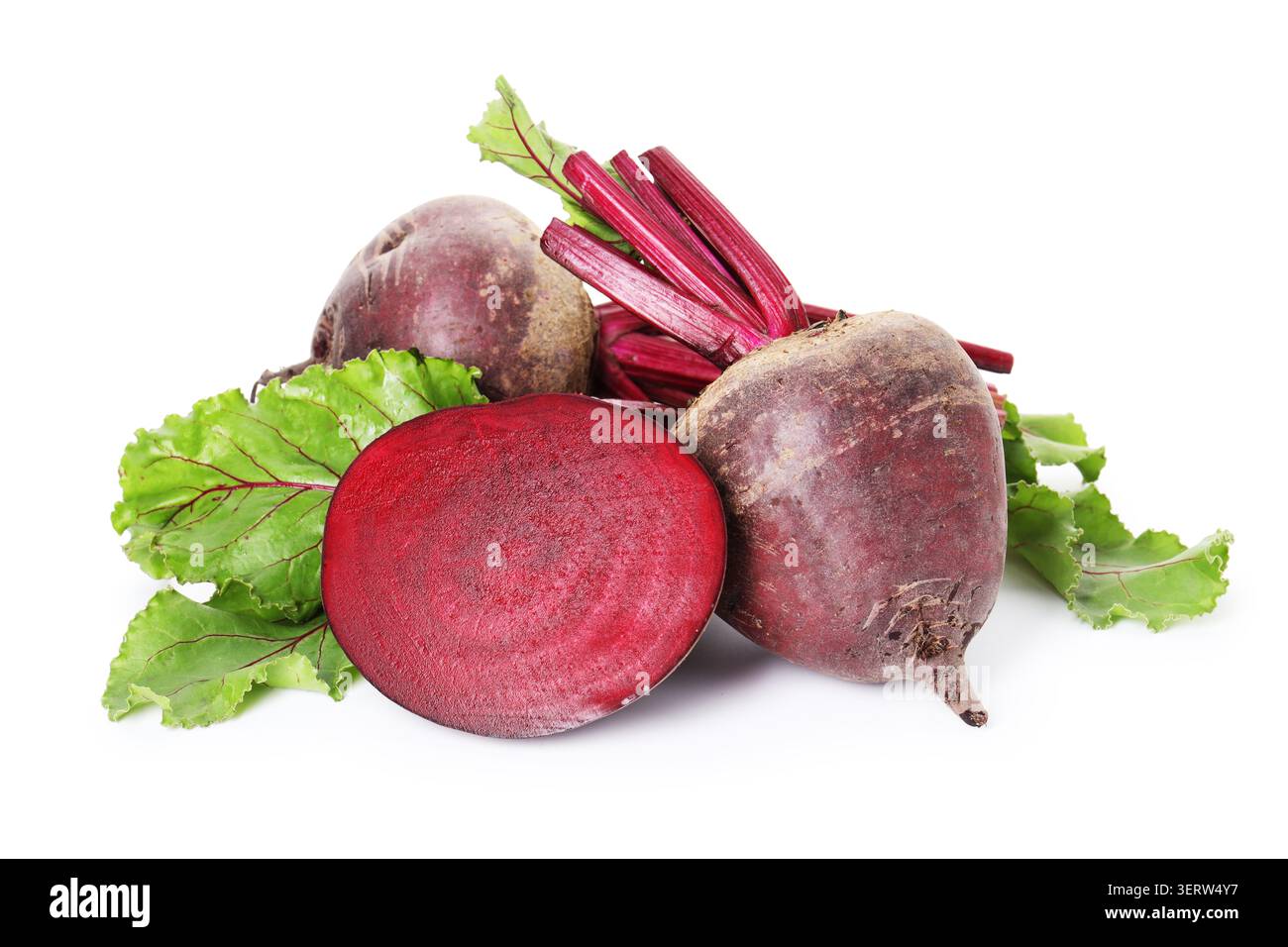 Whole and cut young beets with green leaves isolated on white Stock Photo