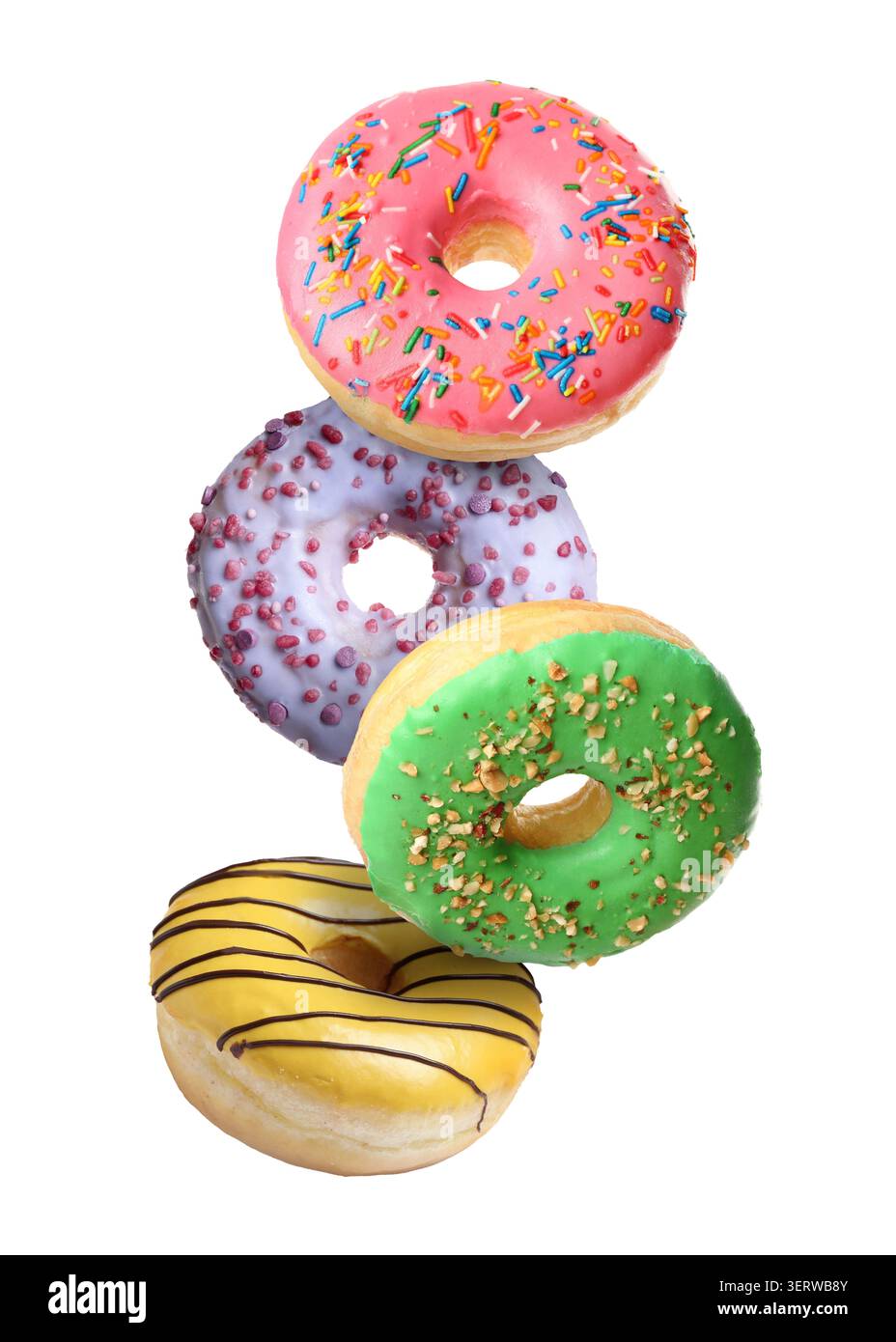 Yummy donuts covered with icing falling on white background Stock Photo