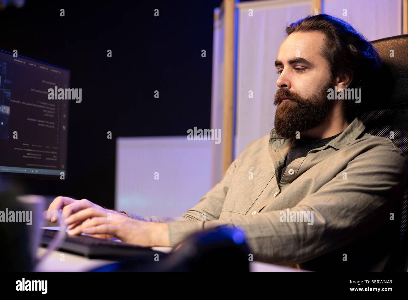 Computer scientist updating artificial intelligence machine learning algorithm, writing binary code scripts; iT specialist in apartment office uses programming to upgrade AI. Stock Photo