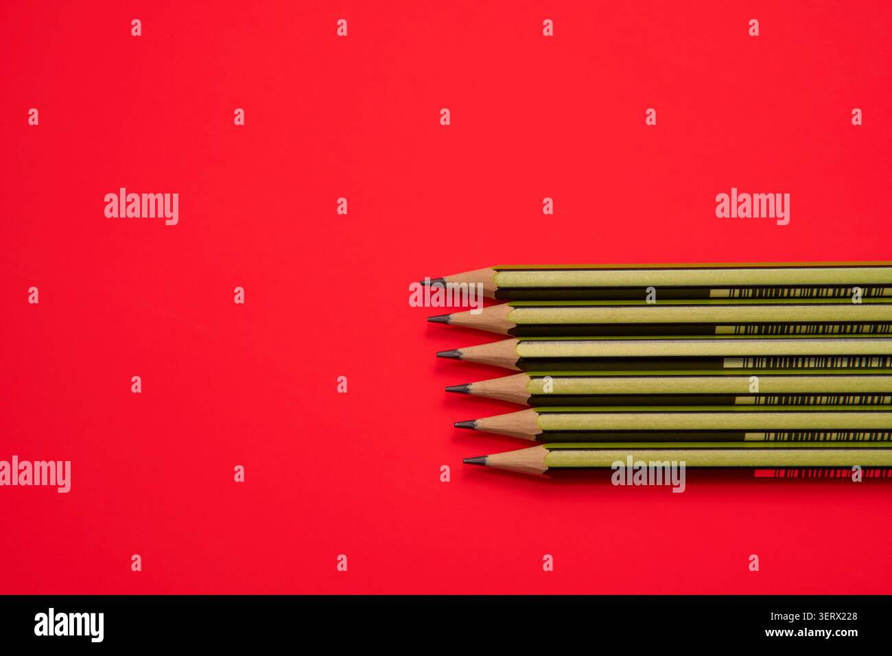Pencils on a red background. Stock Photo