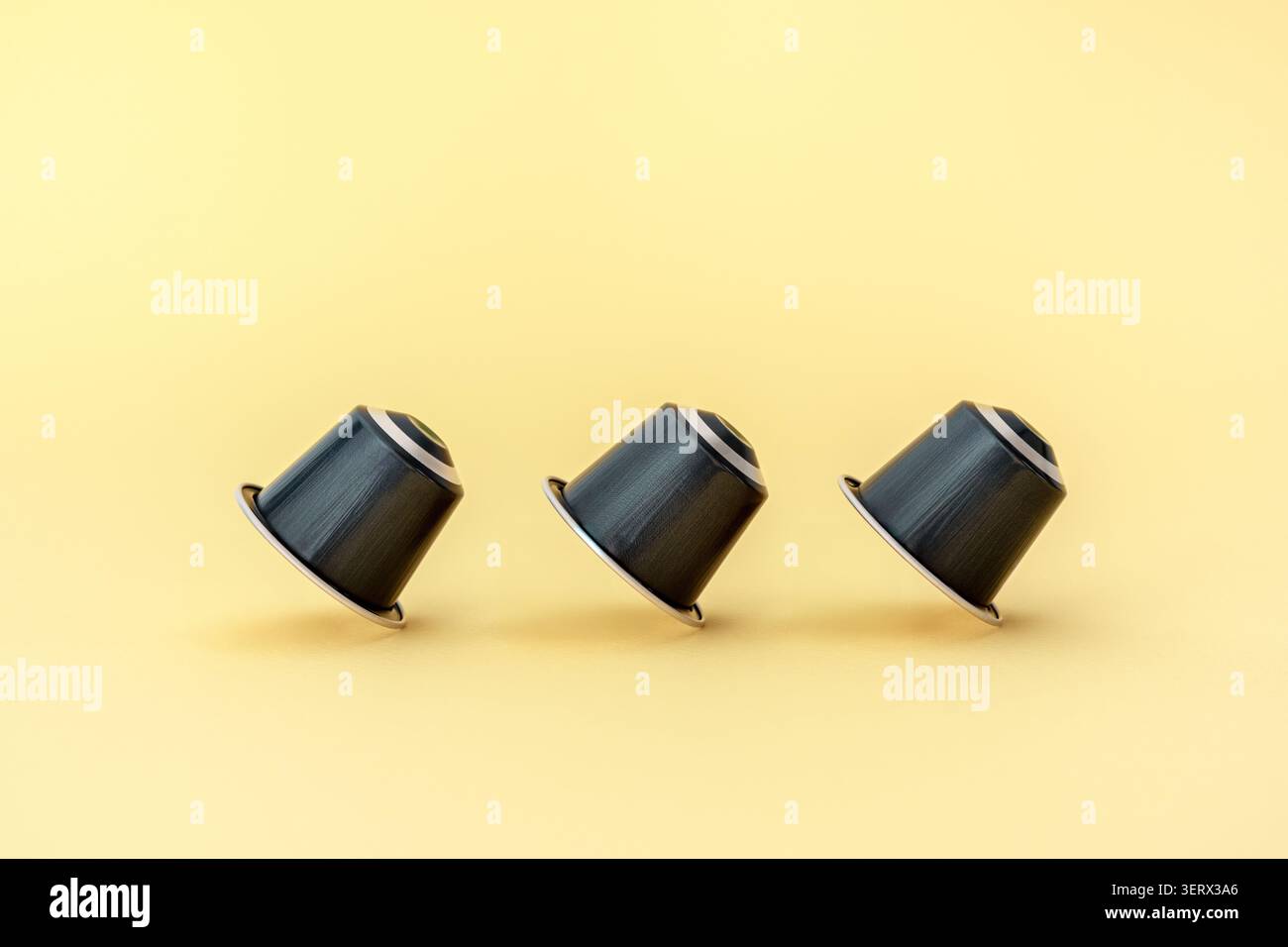 Espresso capsules on a yellow background Stock Photo