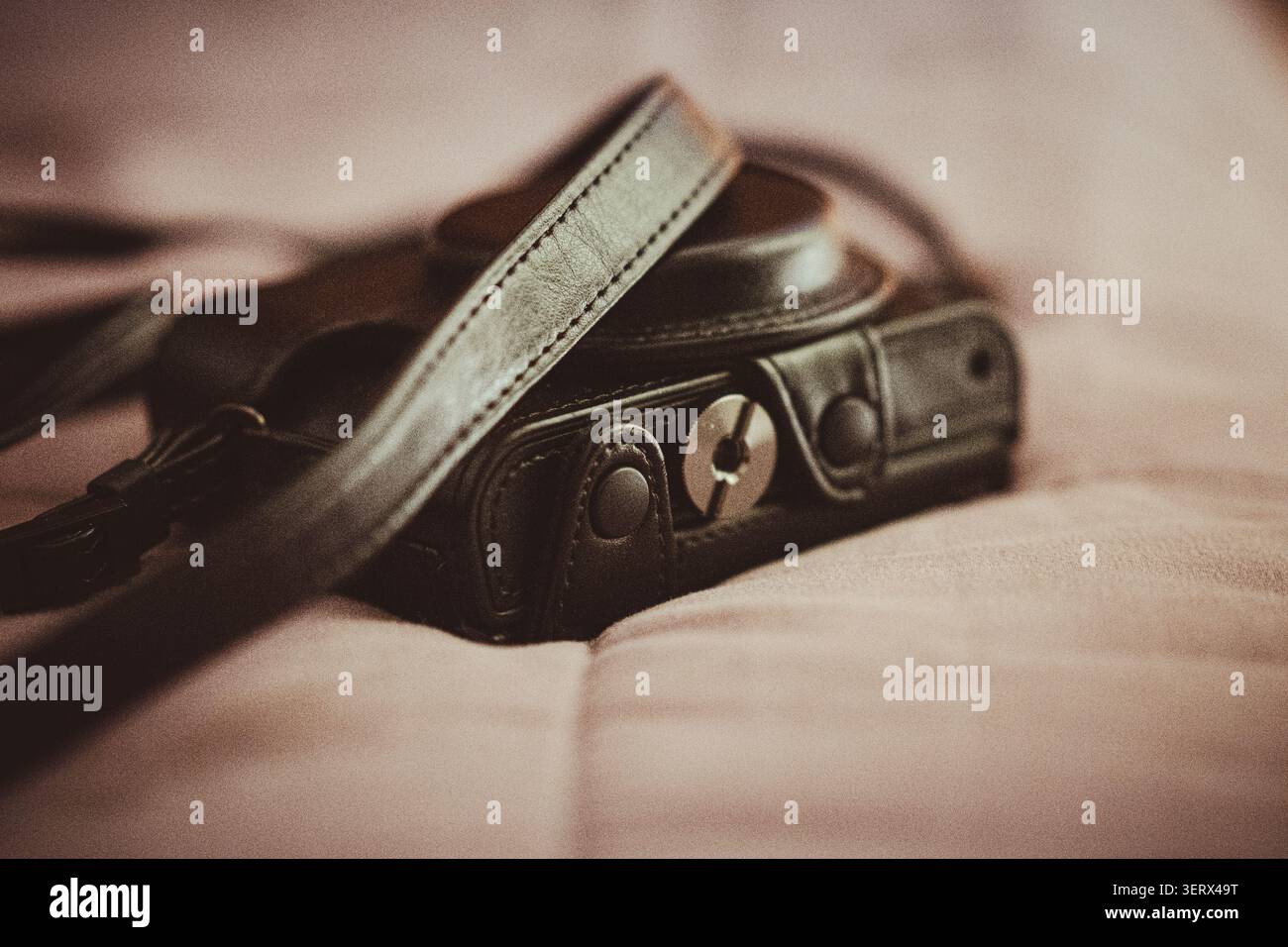 A Camera in its Leather Case. Stock Photo