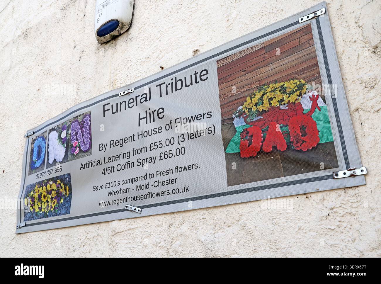 Artificial funeral tribute hire advertised by Regent House of Flowers in Wrexham,Wales,as families face rising funeral costs in the UK cost of living Stock Photo
