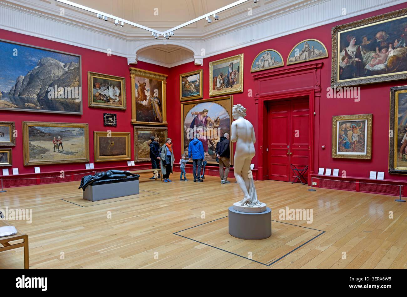 Leeds Art Gallery interior with visitors, paintings and sculpture in Leeds, West Yorkshire, England, UK. Stock Photo