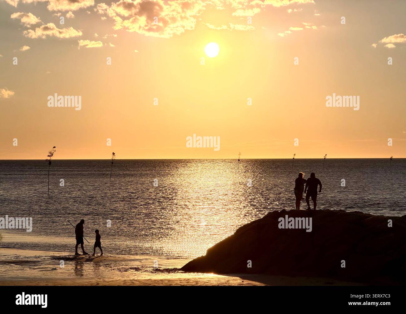 Viewing sunset from a beach and jetty next to Rock Harbor, Orleans, Cape Cod, Massachusetts. - Smartphone Captured Stock Image