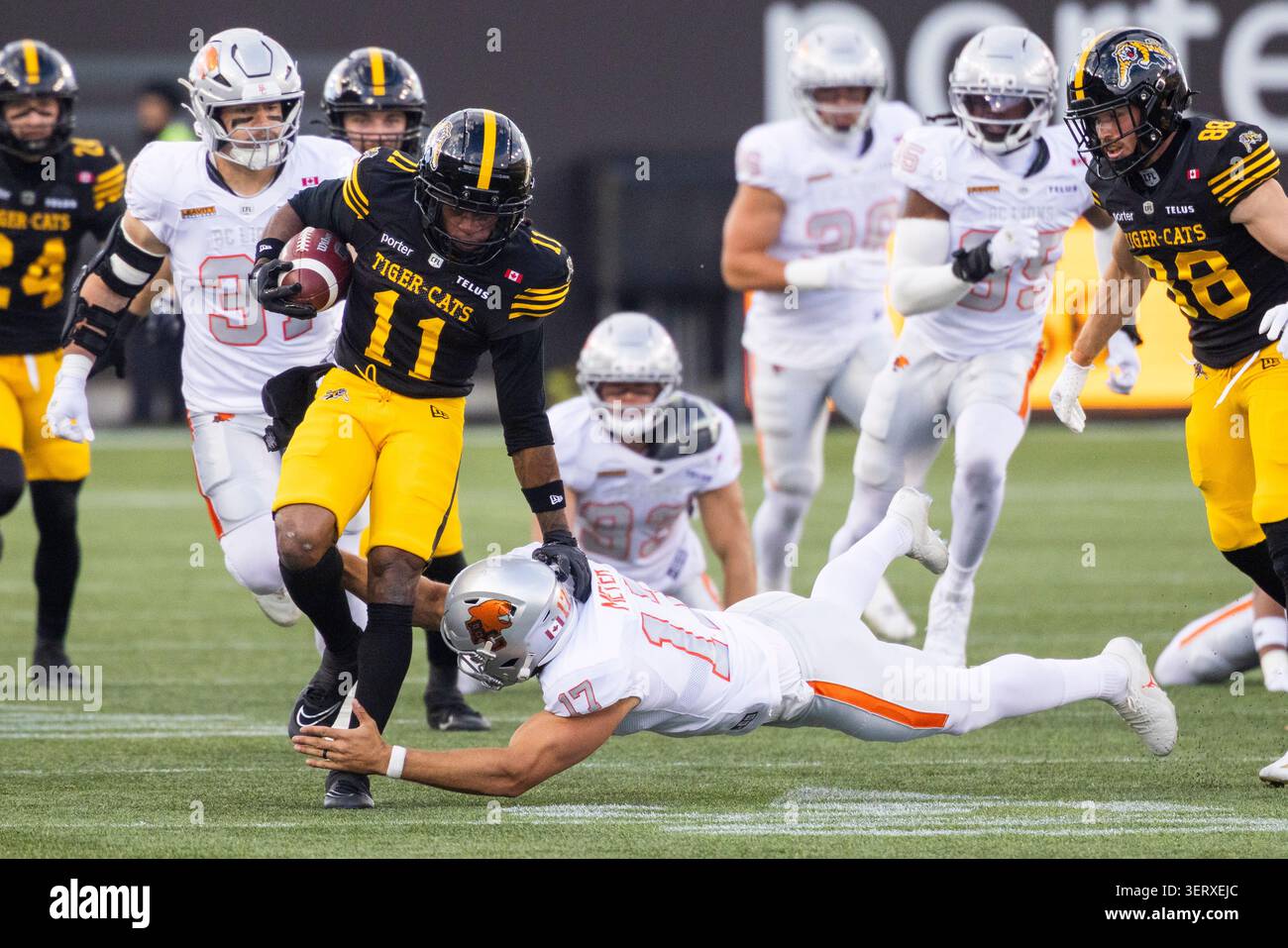 B.C. Lions' Carl Meyer (17) tackles Hamilton Tiger-Cats' Isaiah Wooden ...