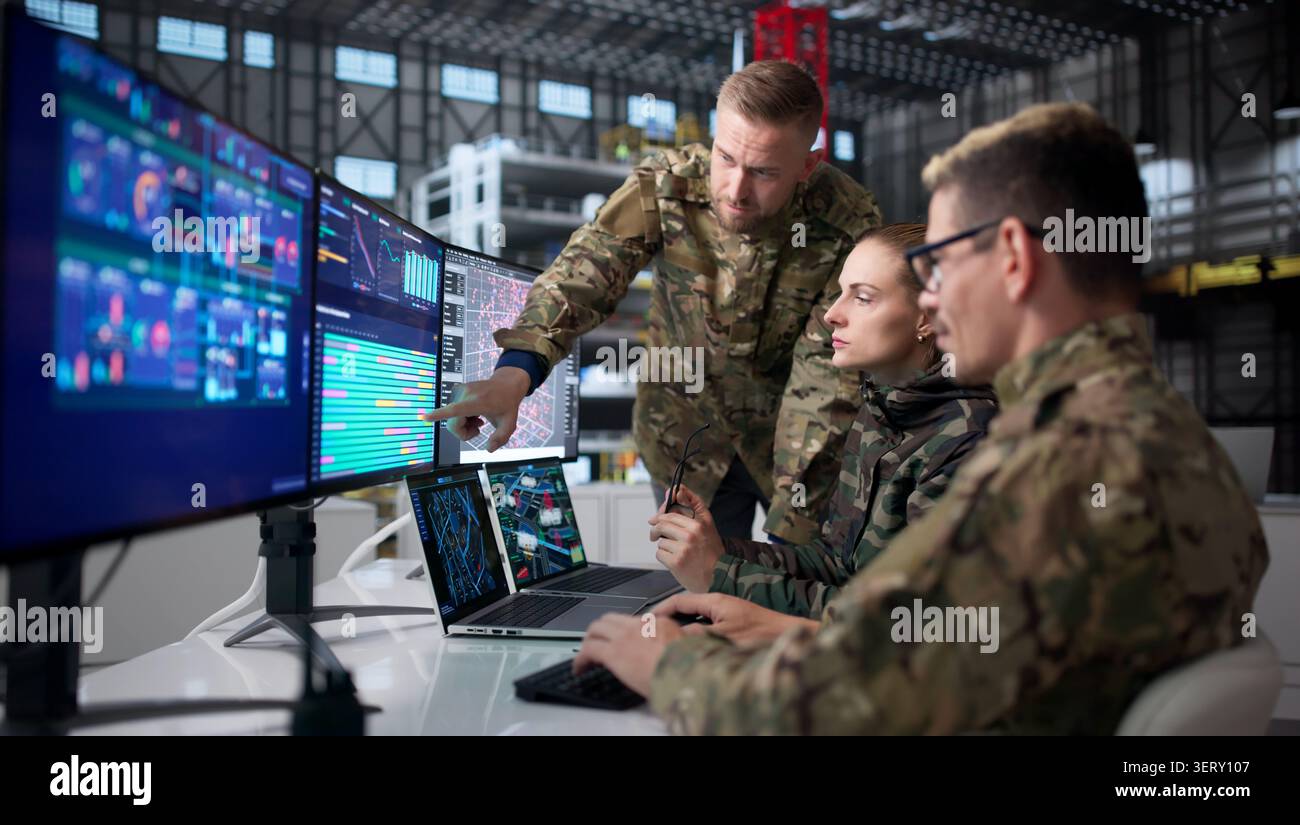 Engineers At Desktop Computers Develop Rocket Designs For Space Automation. Stock Photo