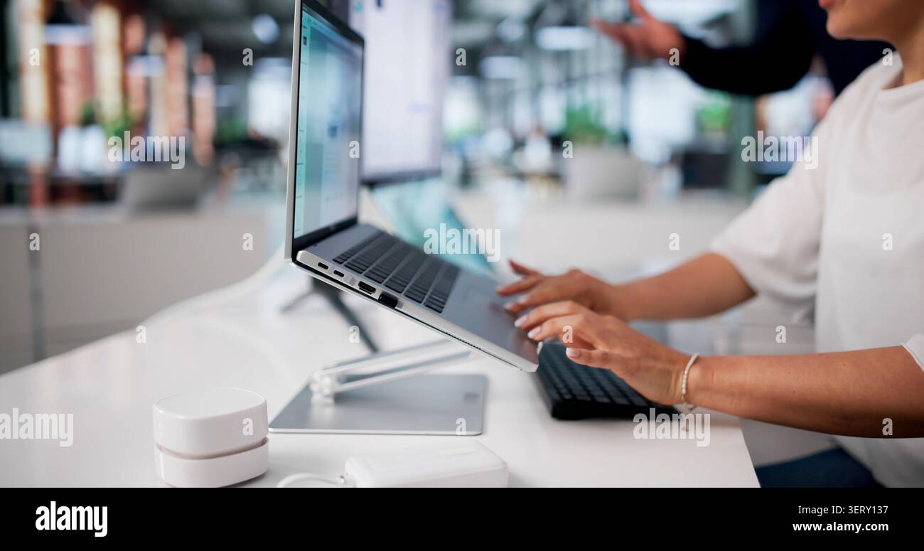 Two Employees Secretly Transferring Confidential Data Using Office Computers. Stock Photo