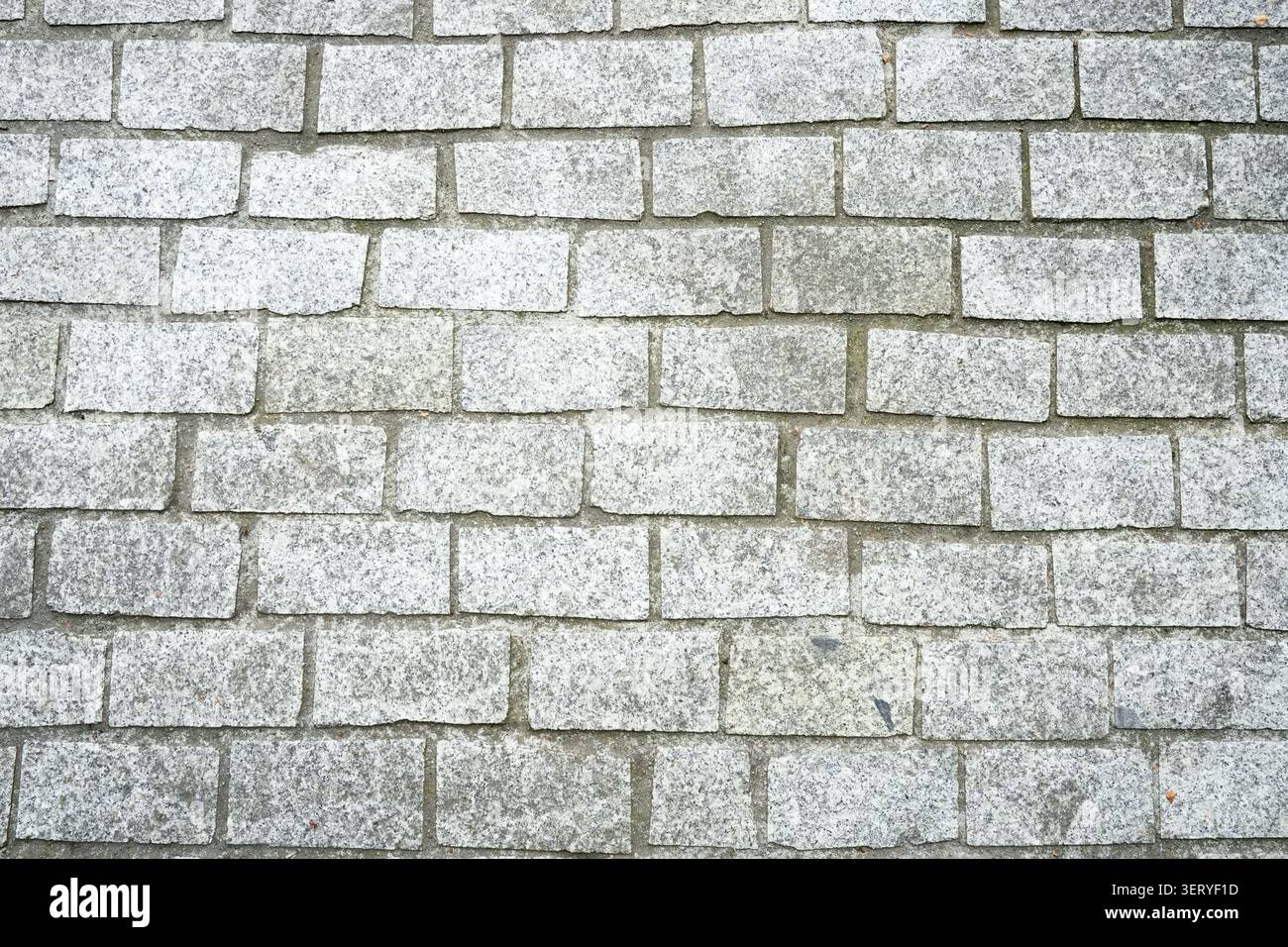 Texture of light gray granite cobblestone pavement Stock Photo