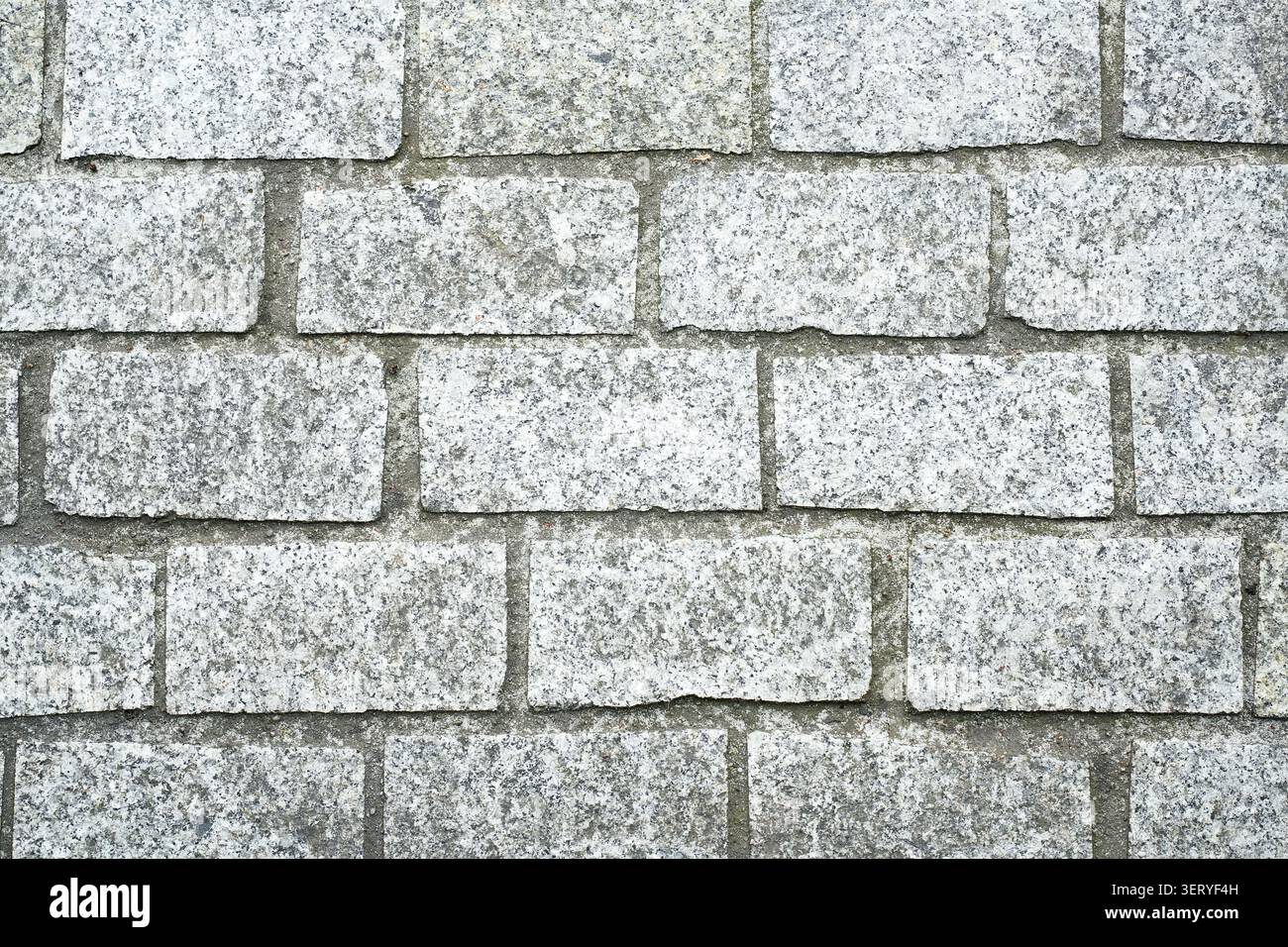 Texture of light gray granite cobblestone pavement Stock Photo