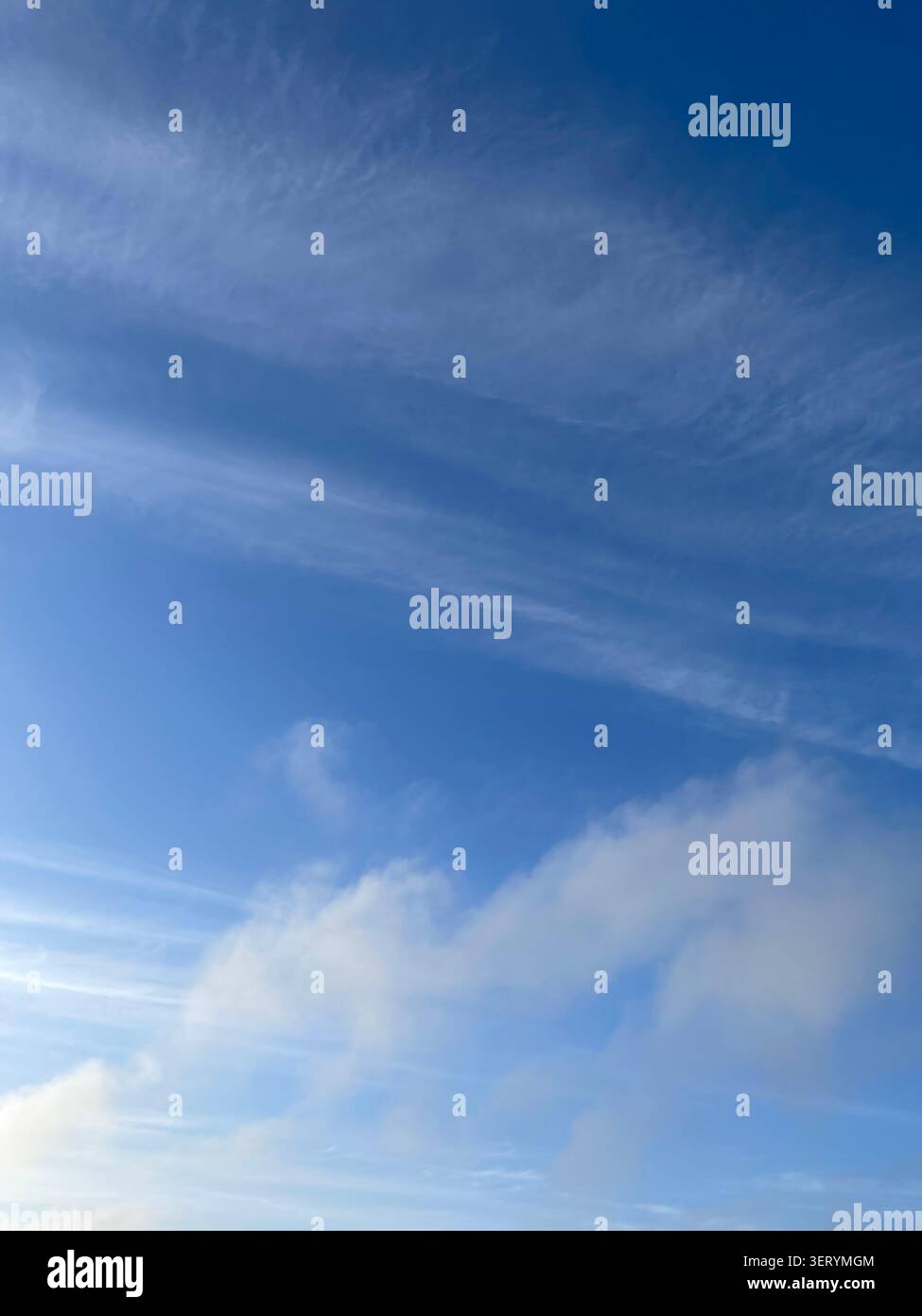 Wispy clouds in the sky Stock Photo