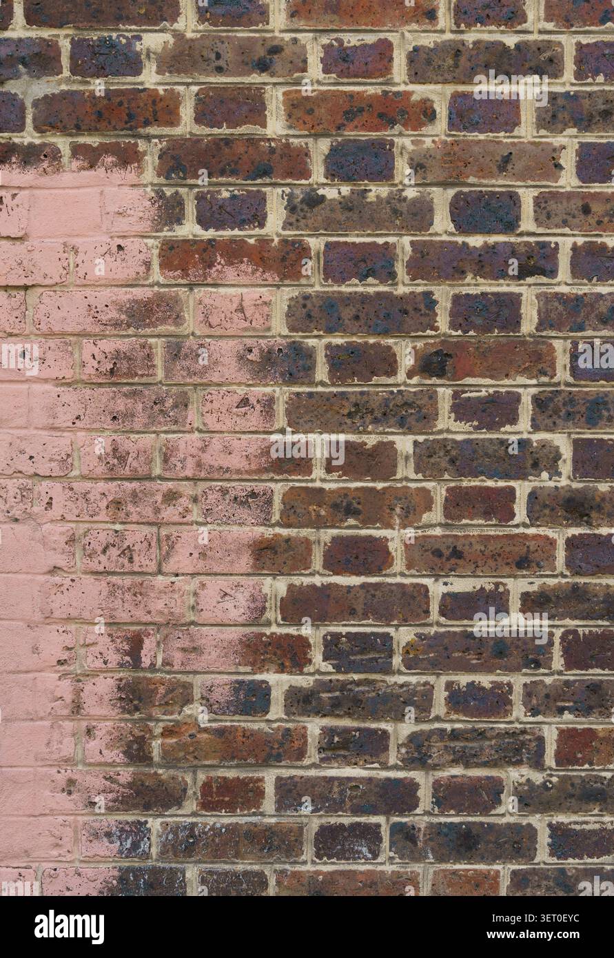 Brick wall with pink paint Stock Photo