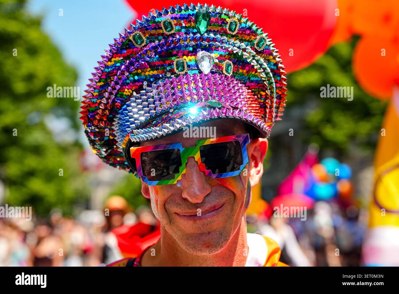A Person Smiles During The Zurich Pride Parade In Zurich Switzerland a-person-smiles-during-the-zurich-pride-parade-in-zurich-switzerland
