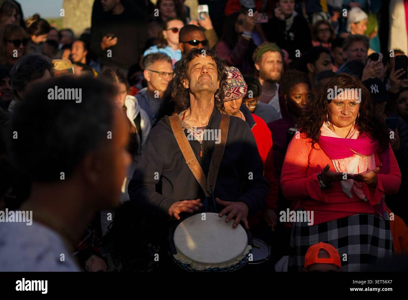 revelers-perform-at-the-ancient-stone-circle-stonehenge-at-sunrise-to