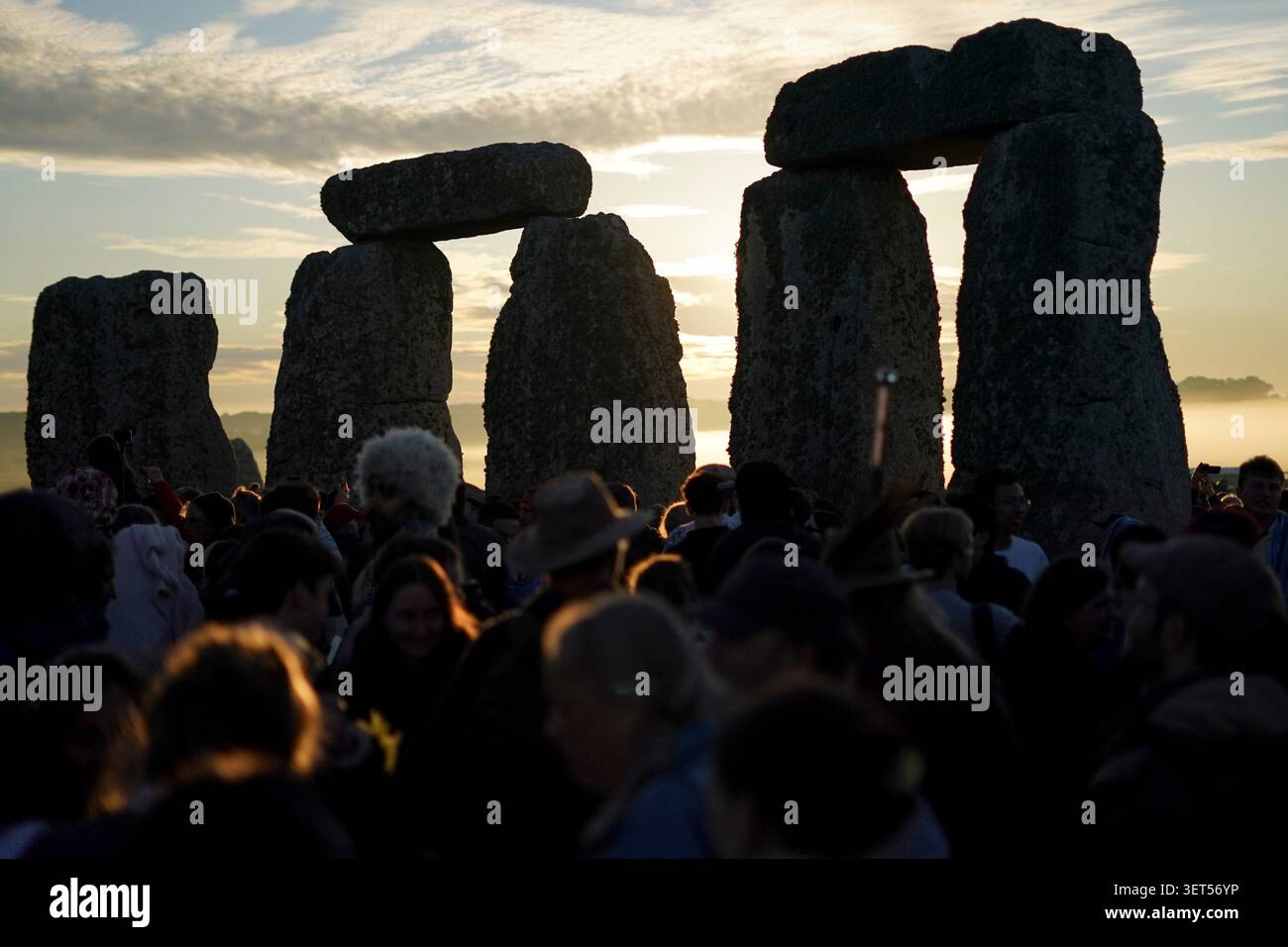 revelers-gather-at-the-ancient-stone-circle-stonehenge-at-sunrise-to