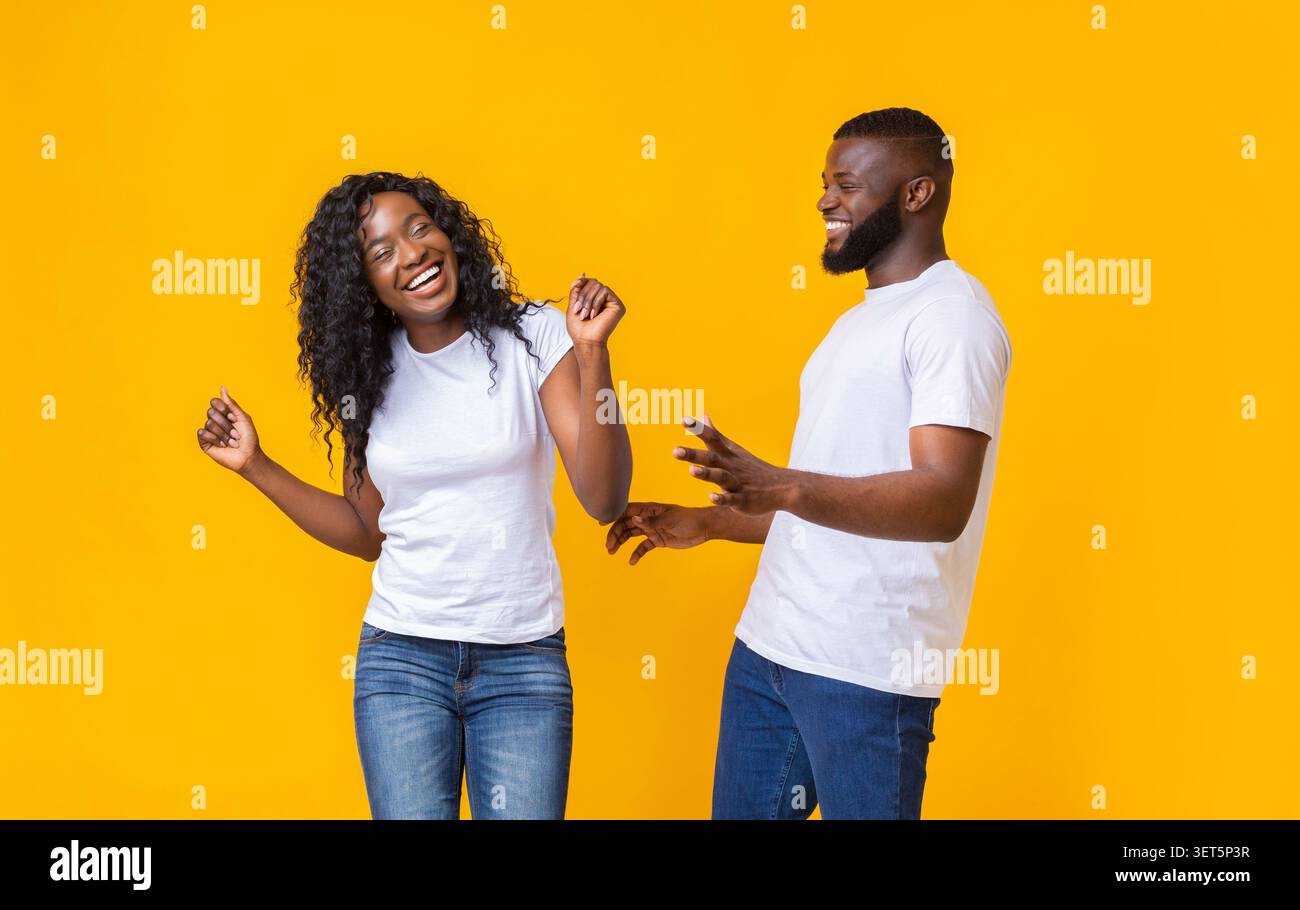 Lovely afro couple having good time with each other Stock Photo