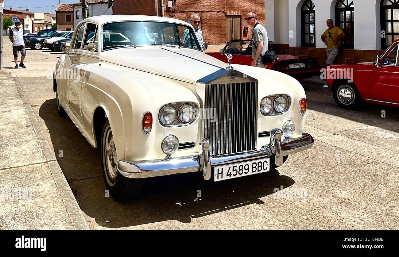 USA specification luxury white Rolls Royce Silver Cloud III car parked during a classic car show in the village of Lantadilla Palencia Spain Europe - Smartphone Captured Stock Image