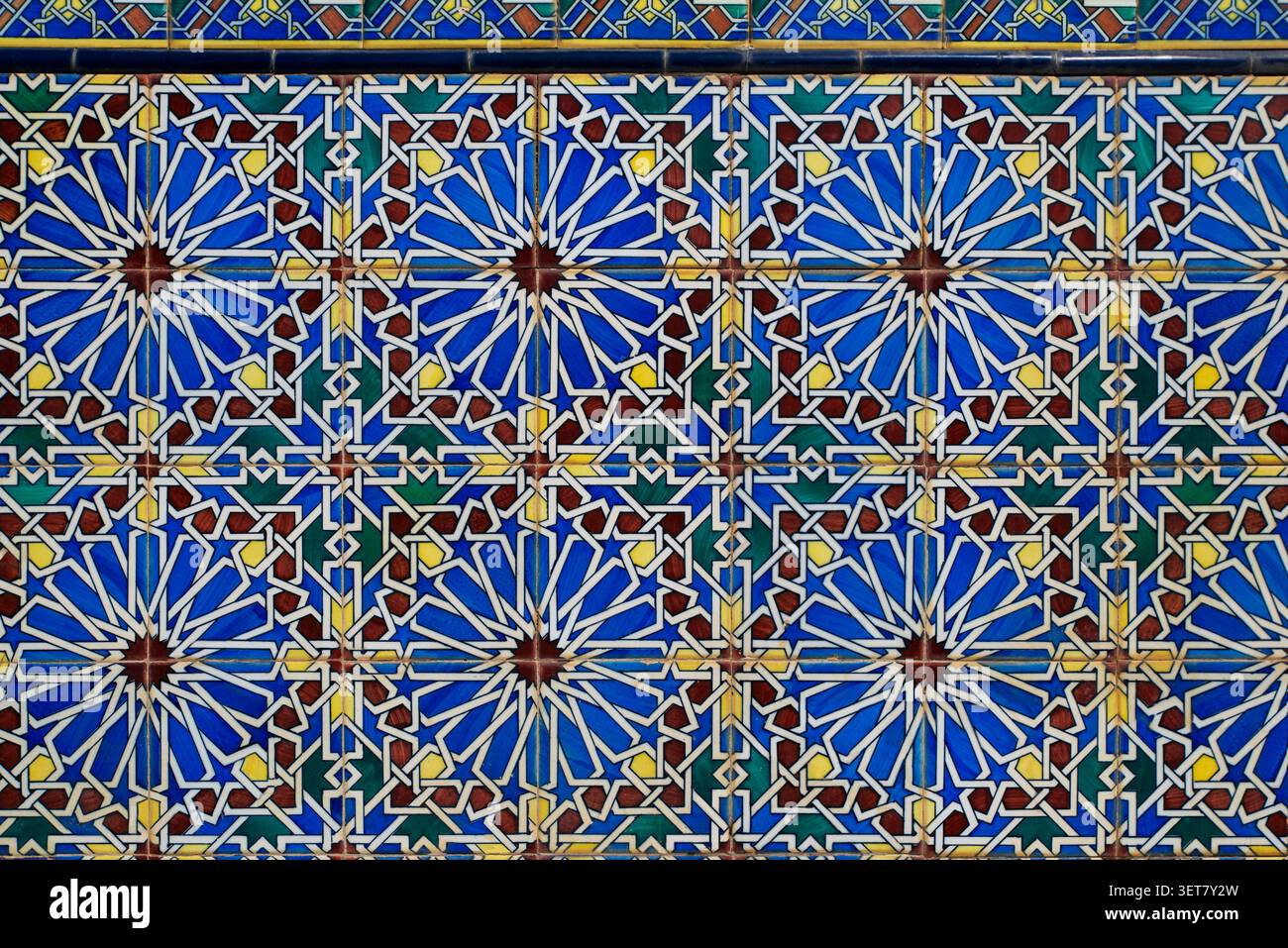 Ceramic tiles with geometric patterns in blue and yellow. Stock Photo