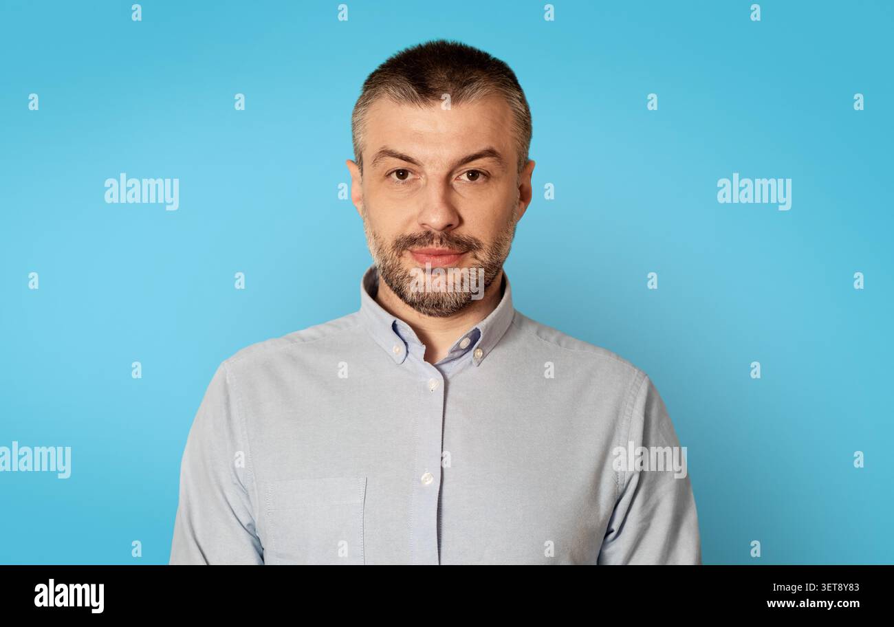 Confident Middle-aged Man With Beard Posing At Camera, Business Concept Stock Photo