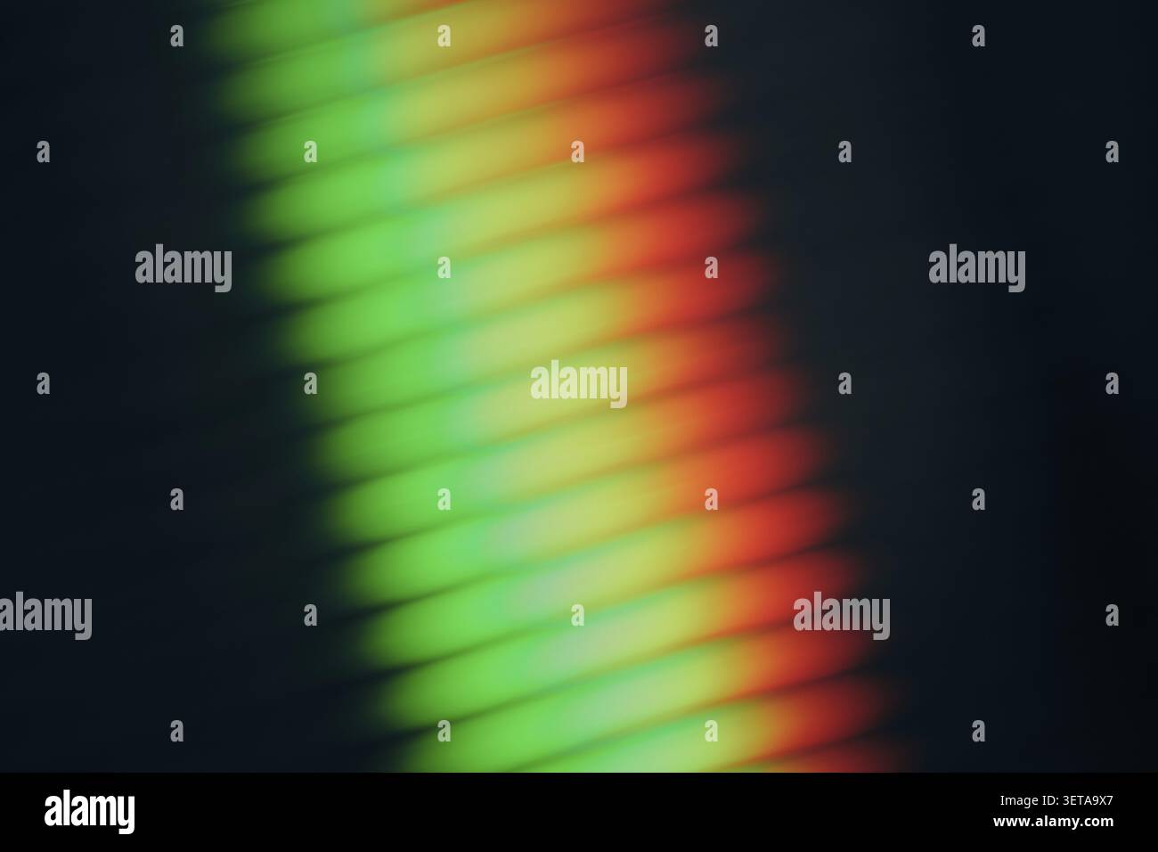 Abstract rainbow light refraction through ribbed glass, modern gradient background Stock Photo