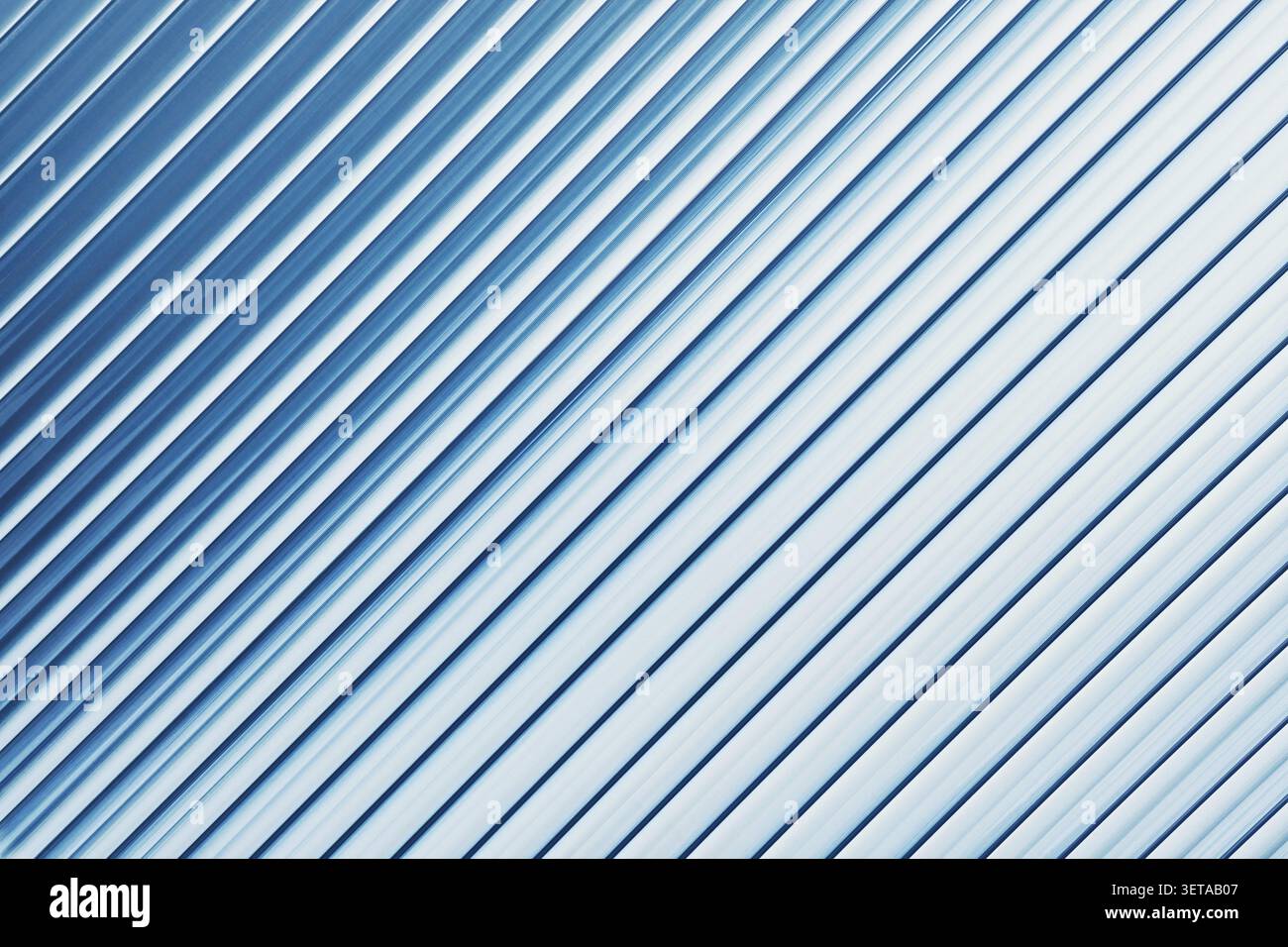 Blue striped ribbed glass background, diagonal abstract texture Stock Photo